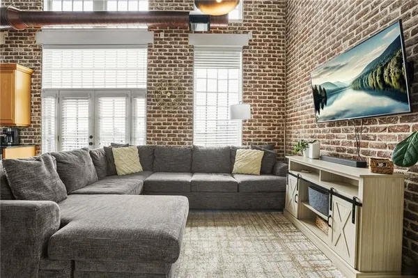 a living room with a couch next to a window