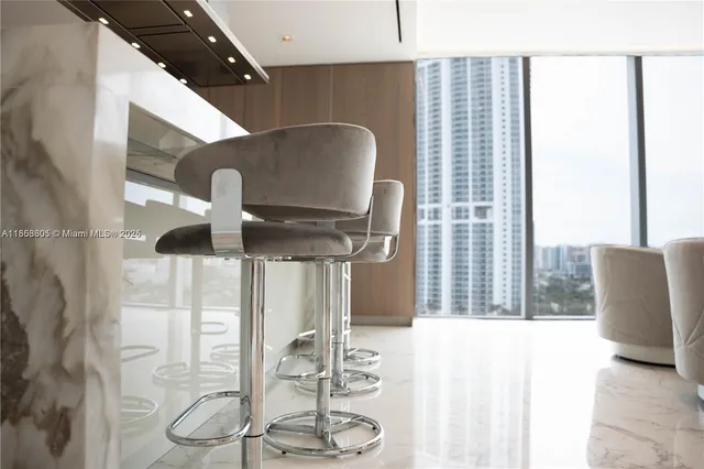 a balcony with table and chairs