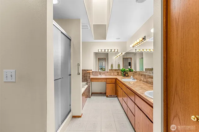 a large white kitchen with a large window
