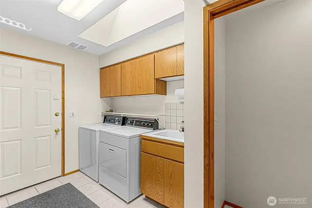 a kitchen with a stove top oven sink and cabinets