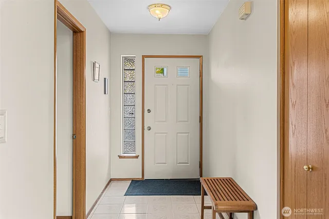 a view of room with walk in closet and wooden floor