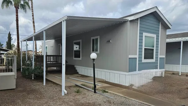 a front view of a house with parking space