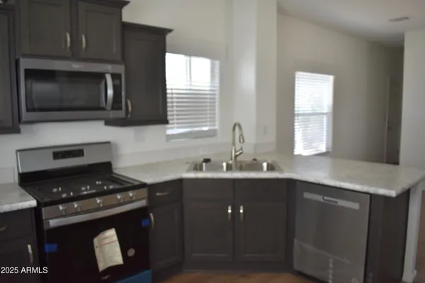 a kitchen with a stove and a sink