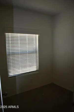 a view of a room that has a window in it