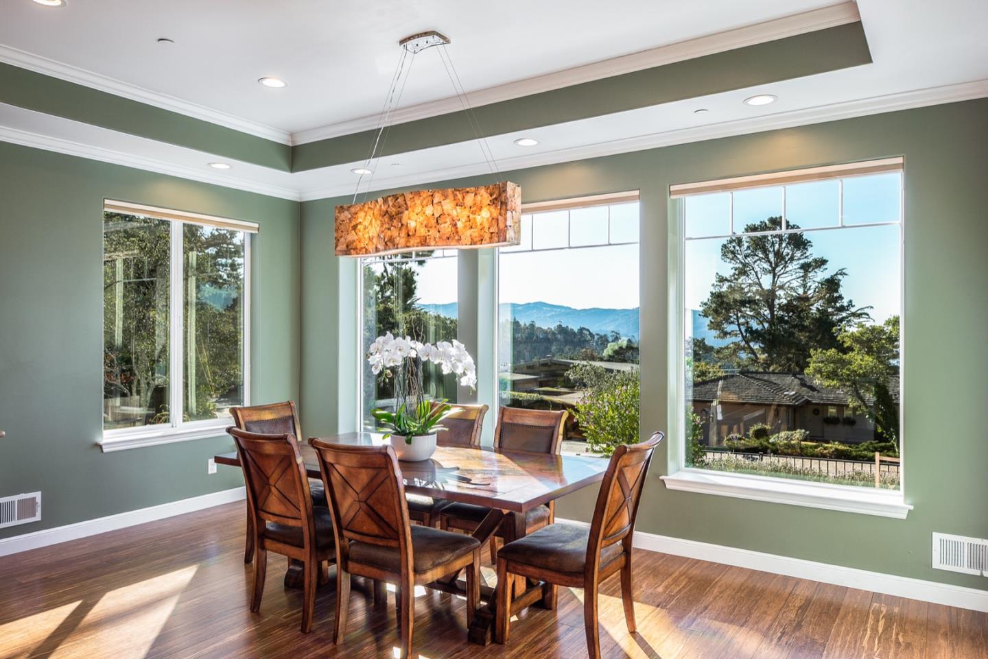 4157 Sunridge Road Pebble Beach, CA 93953 - Photo 2 of 25 a view of a dining room with furniture window and wooden floor