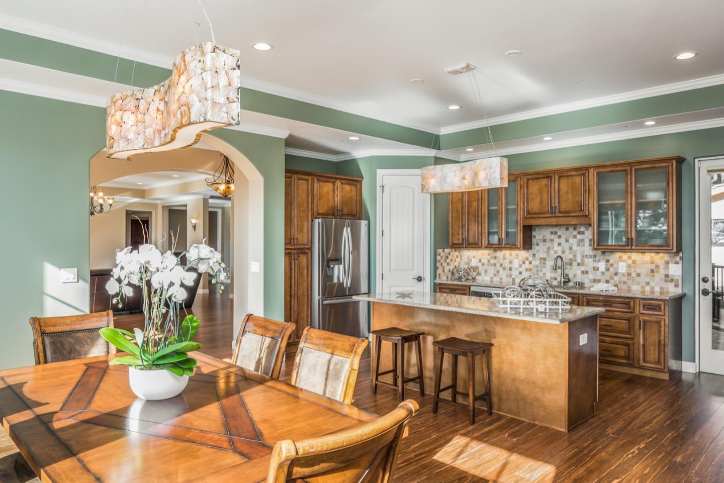 4157 Sunridge Road Pebble Beach, CA 93953 - Photo 6 of 25 a view of a dining room with furniture window and wooden floor