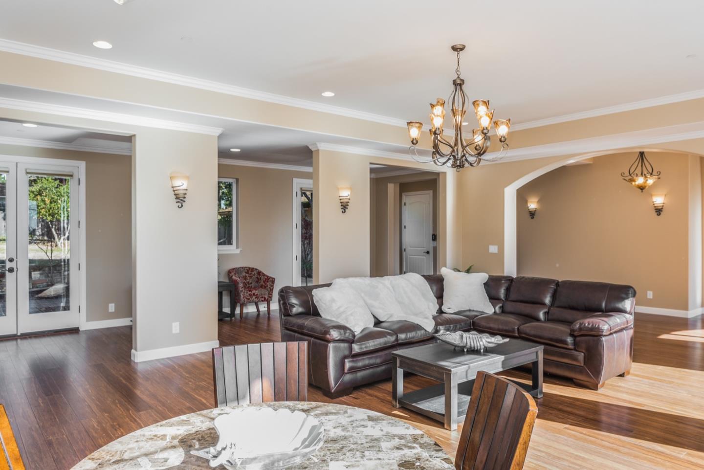 4157 Sunridge Road Pebble Beach, CA 93953 - Photo 7 of 25 a living room with furniture a table and wooden floor