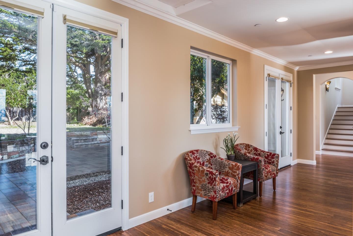 4157 Sunridge Road Pebble Beach, CA 93953 - Photo 8 of 25 a living room with furniture and wooden floor