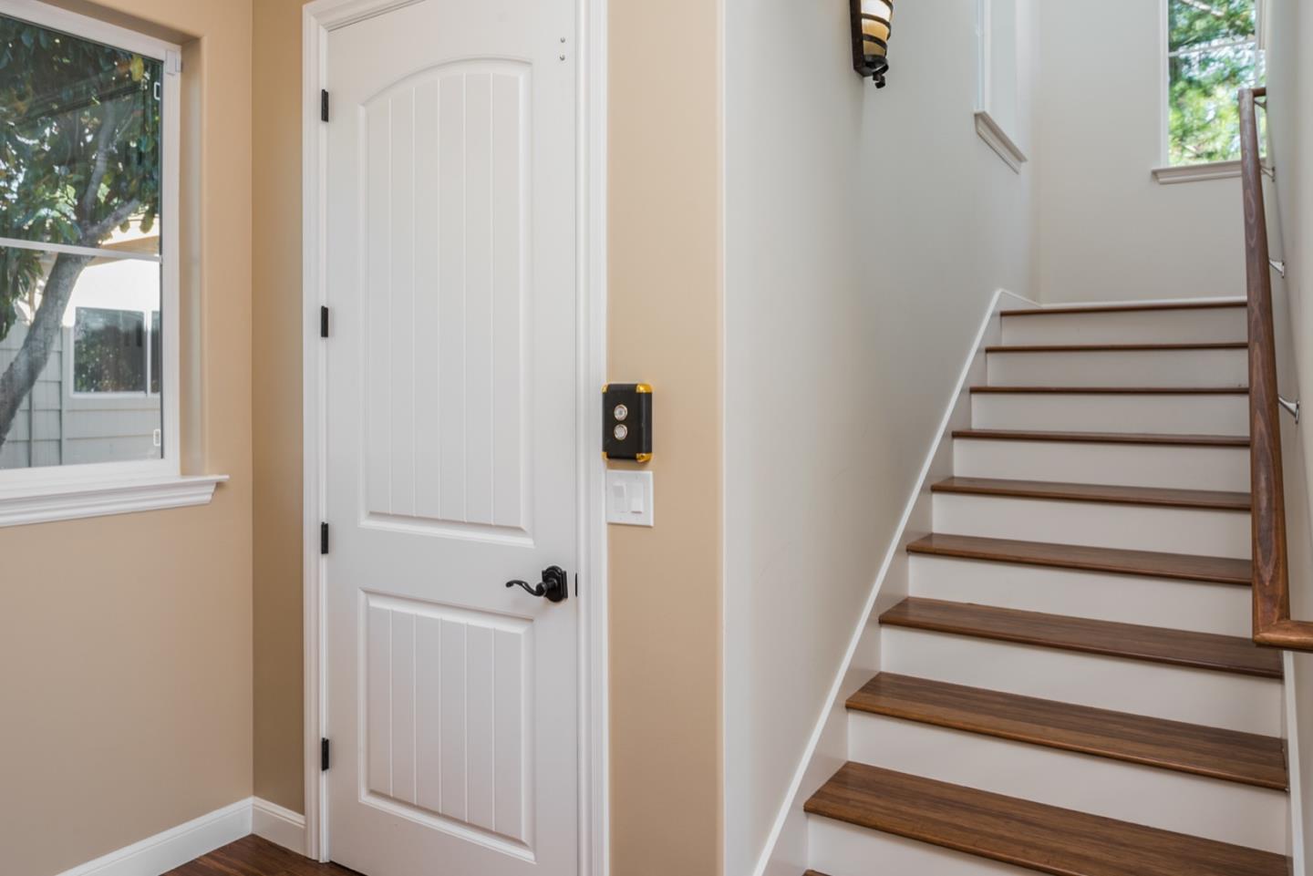 4157 Sunridge Road Pebble Beach, CA 93953 - Photo 9 of 25 a view of a hallway with wooden floor and entryway