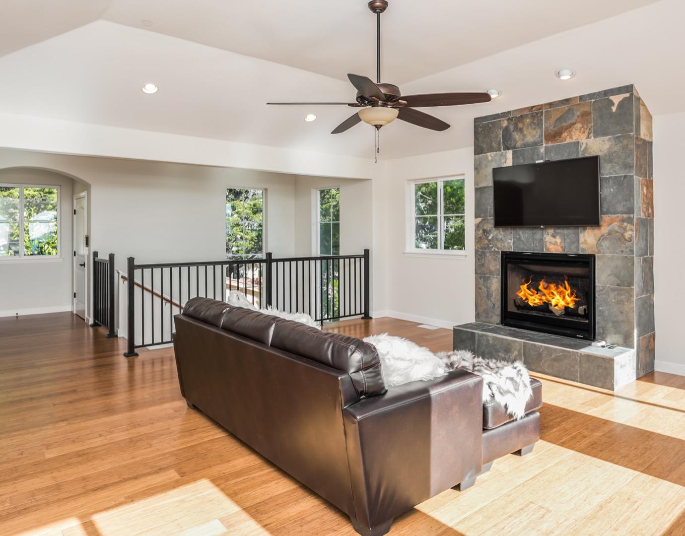 4157 Sunridge Road Pebble Beach, CA 93953 - Photo 10 of 25 a living room with furniture and a flat screen tv