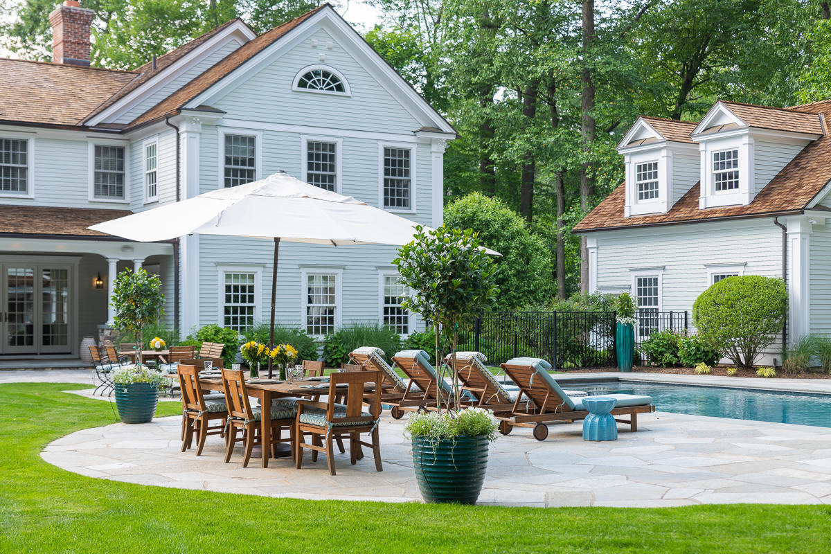 8 Shady Acres Road Darien, CT 06820 - Photo 2 of 18 a front view of a house with garden and sitting area