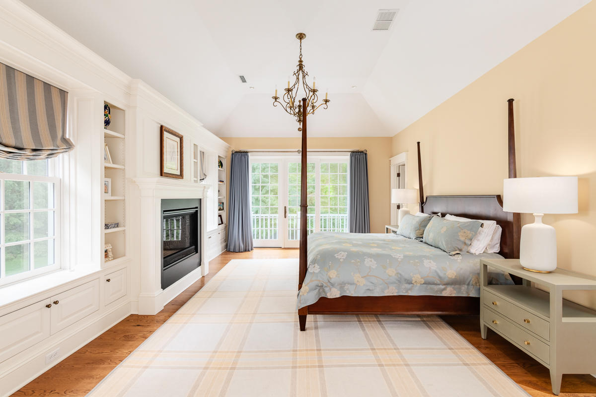 8 Shady Acres Road Darien, CT 06820 - Photo 12 of 18 a bedroom with a bed and a fireplace