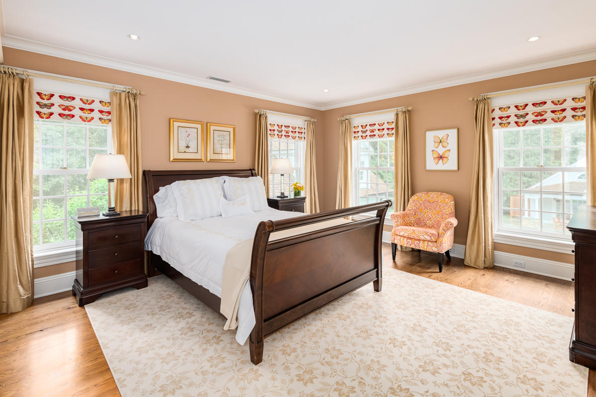 8 Shady Acres Road Darien, CT 06820 - Photo 14 of 18 a bedroom with a bed and a couch next to a window