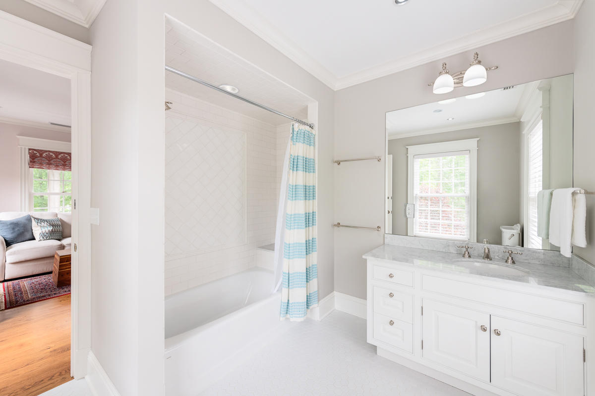 8 Shady Acres Road Darien, CT 06820 - Photo 17 of 18 a bathroom with a double vanity sink a mirror and a bathtub