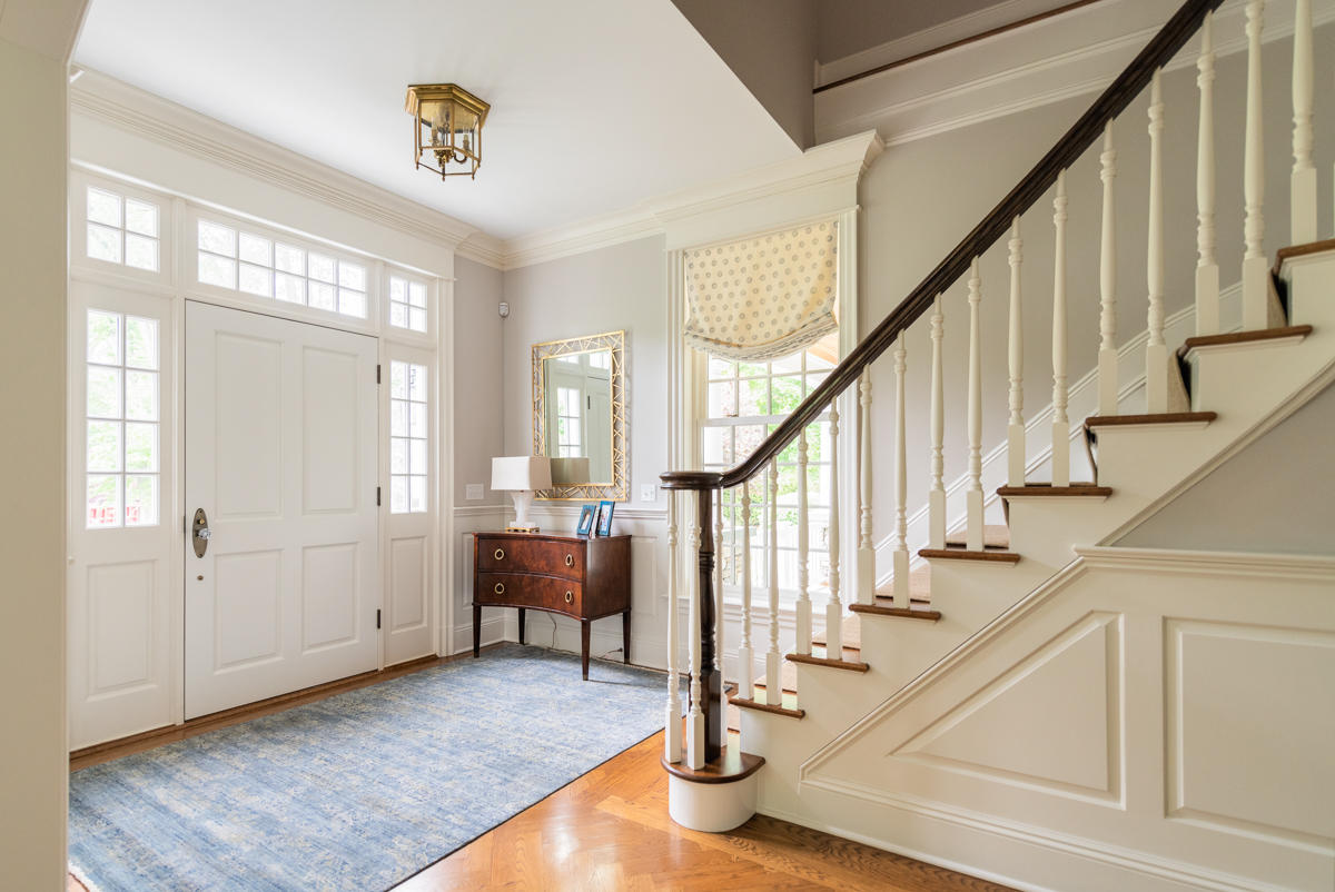 8 Shady Acres Road Darien, CT 06820 - Photo 3 of 18 a view of staircase with wooden floor and windows