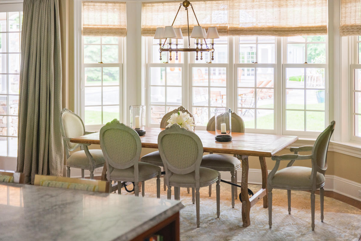 8 Shady Acres Road Darien, CT 06820 - Photo 10 of 18 a dining room with furniture a chandelier and wooden floor