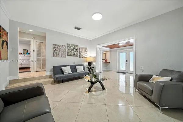 a living room with furniture and a couch