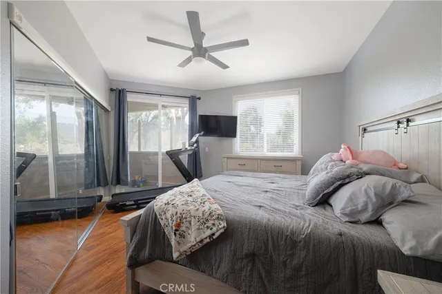 a bedroom with a large bed and a window