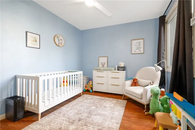 a bedroom with furniture and a rug