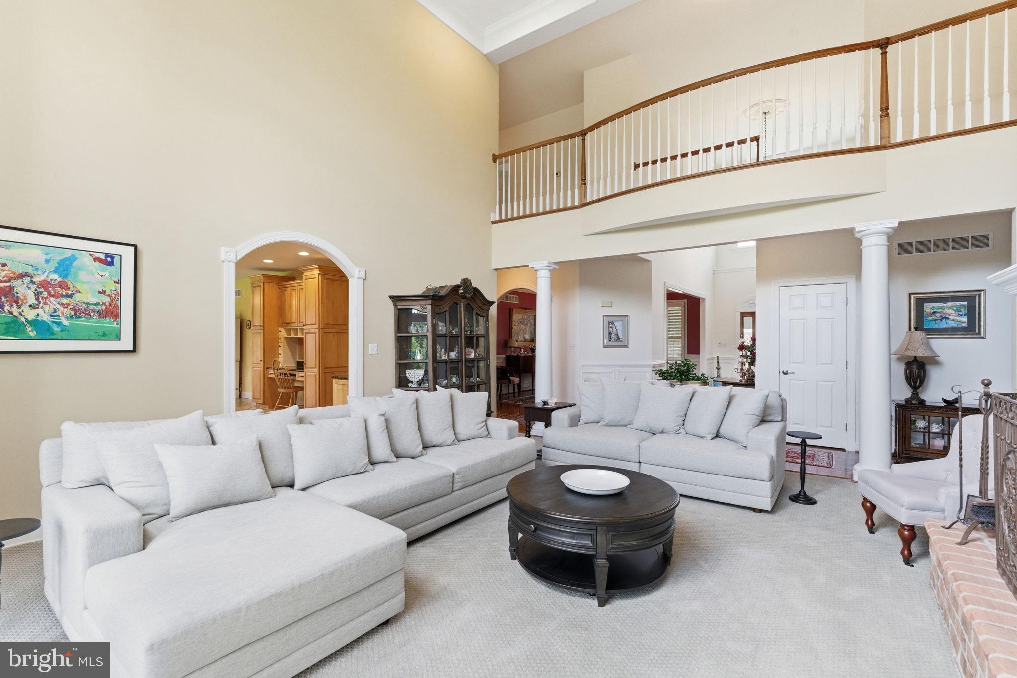 9 Deer Ridge Court Phoenix, MD 21131 - Photo 24 of 96 a living room with furniture a rug and white walls