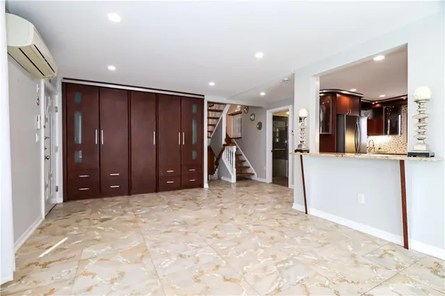 a view of a hallway with a bathroom