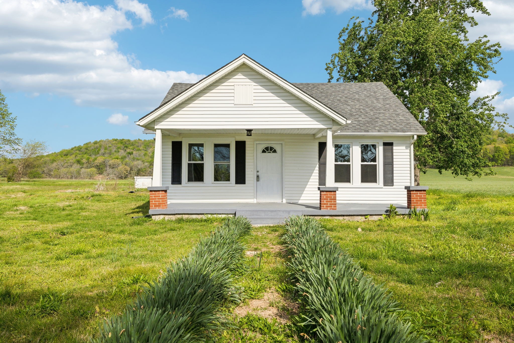 57 Young Branch Road Dixon Springs, TN 37057 - Photo 1 of 24 a view of a house with a yard and sitting area