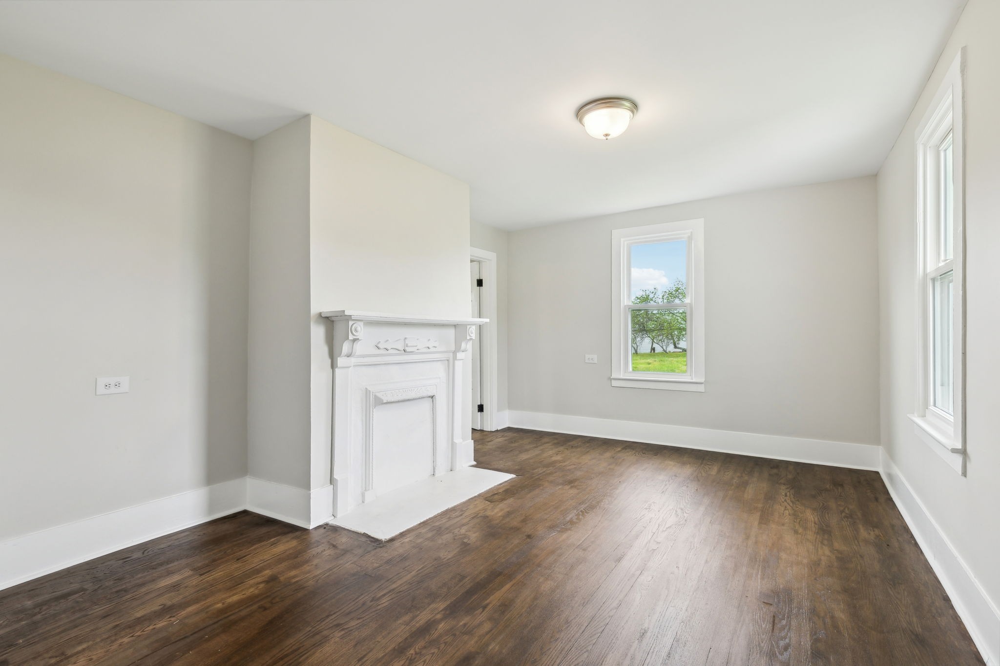 57 Young Branch Road Dixon Springs, TN 37057 - Photo 13 of 24 an empty room with wooden floor cabinet and windows