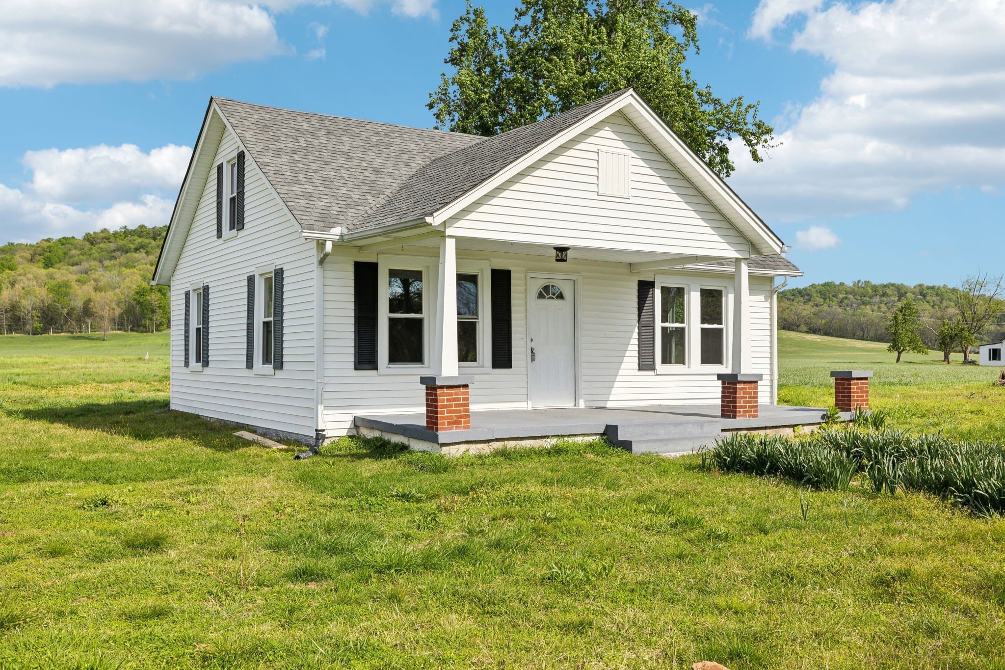 57 Young Branch Road Dixon Springs, TN 37057 - Photo 2 of 24 a view of a house with a yard and sitting area