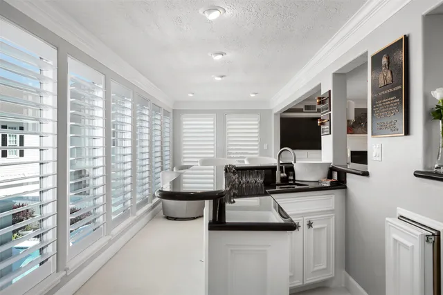 a kitchen with stainless steel appliances a refrigerator and a stove
