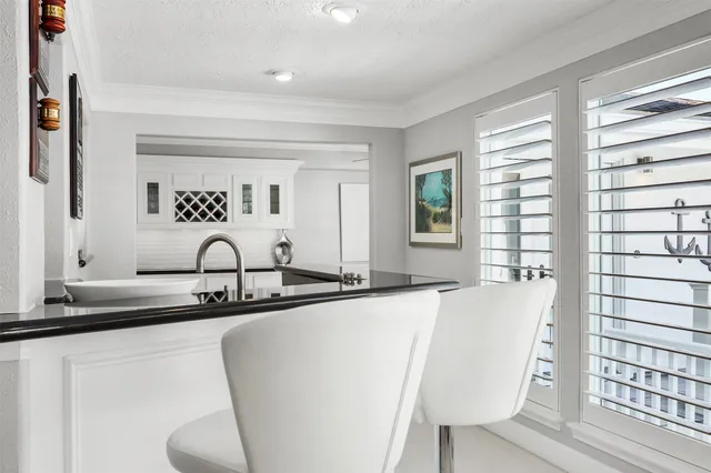 a bathroom with a sink mirror and toilet