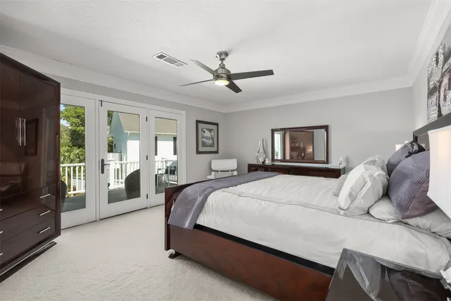 an aerial view of a house with outdoor space and a lake view