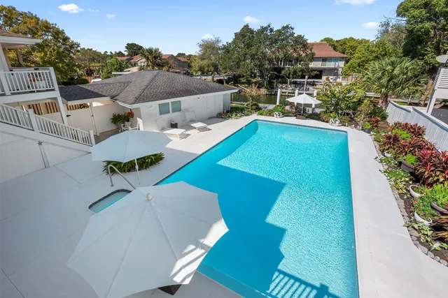 a bathroom with a bathtub sink and mirror