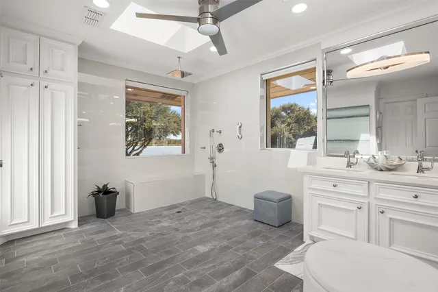 a front view of a house with a yard table and chairs