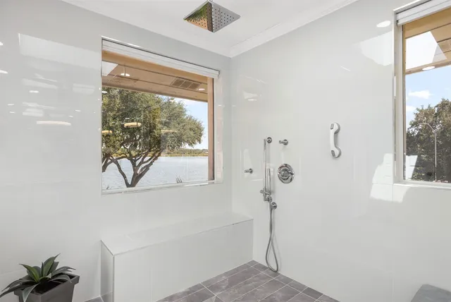 a view of a kitchen has a sink and a stove with wooden floor
