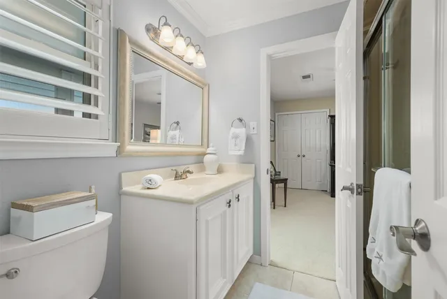 an aerial view of a house with outdoor space and lake view