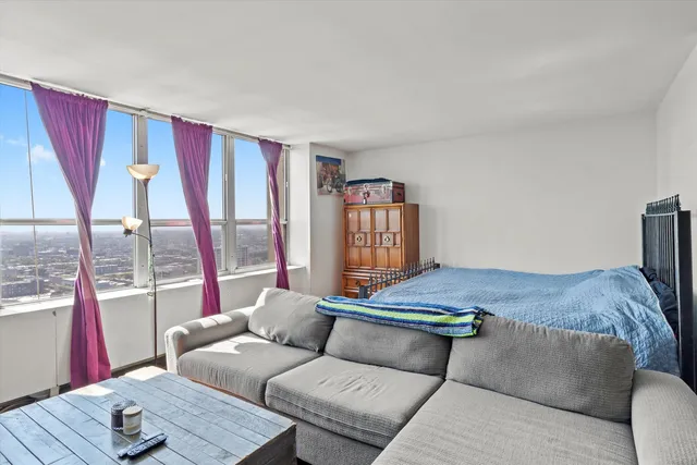 a living room with furniture and a window