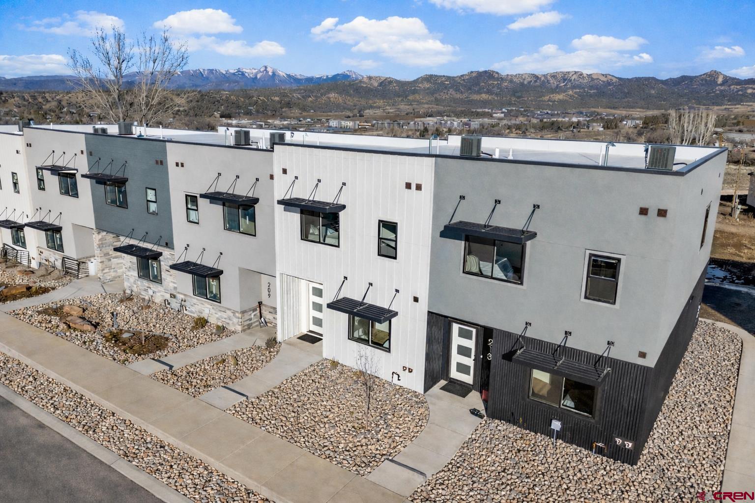 205 Treeline Street Durango, CO 81303 - Photo 8 of 39 a view of a house with a yard and mountain view