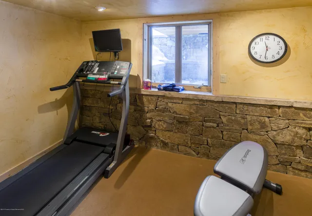 a bathroom with a toilet a sink and a mirror
