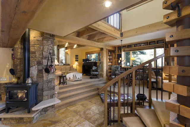a view of staircase with a table and chairs