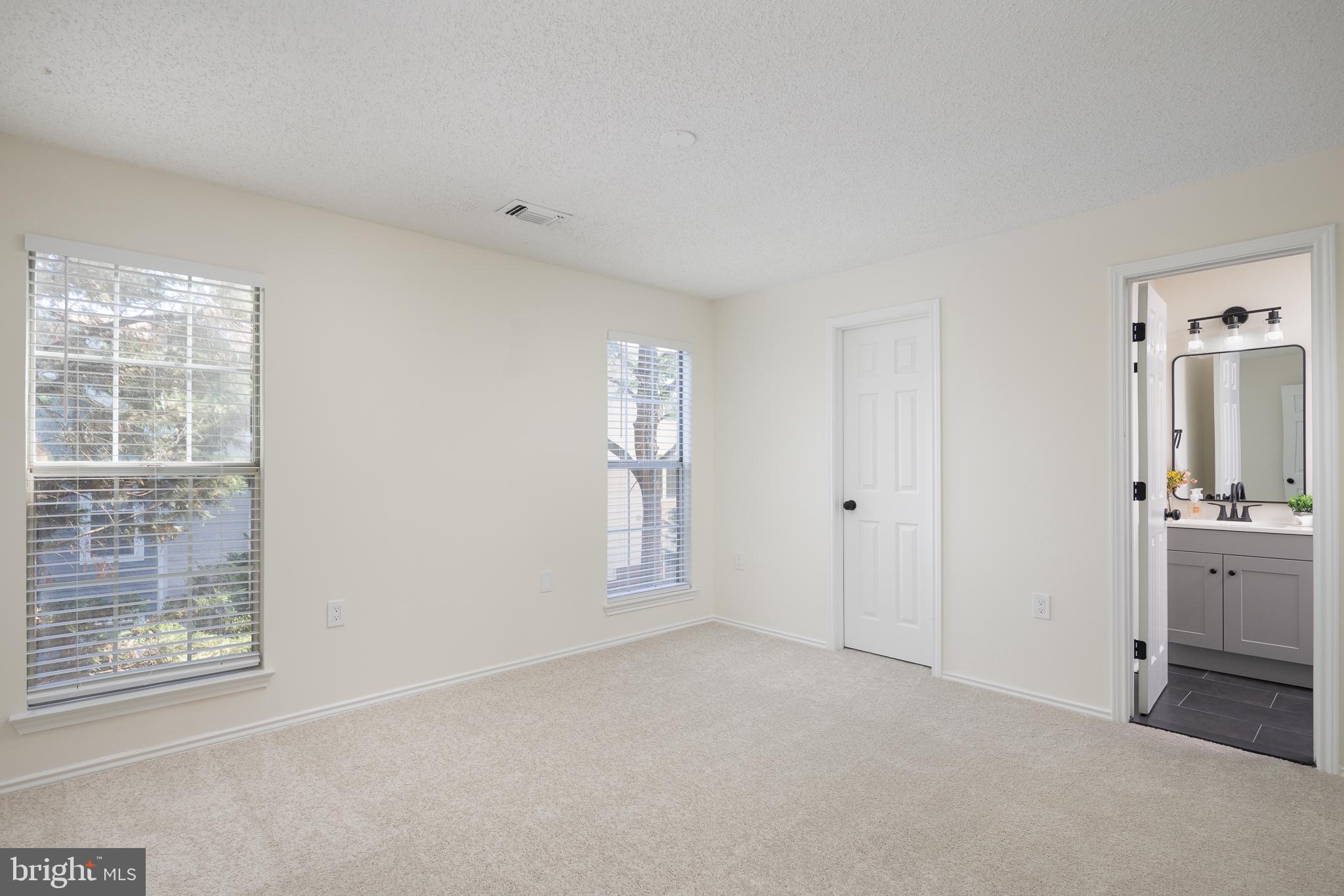 21009 Timber Ridge Terrace, Unit 203 Ashburn, VA 20147 - Photo 37 of 38 Primary Bedroom