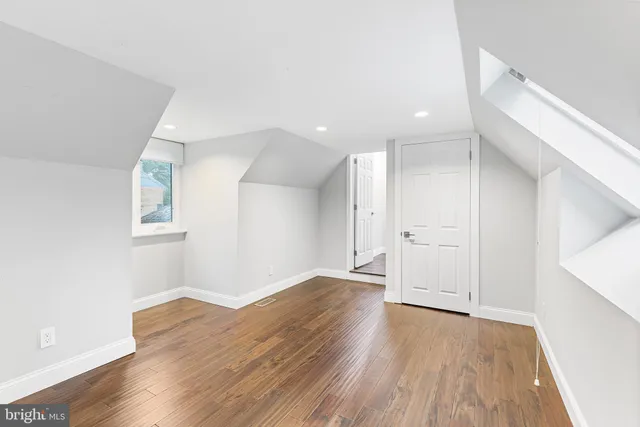 an empty room with wooden floor
