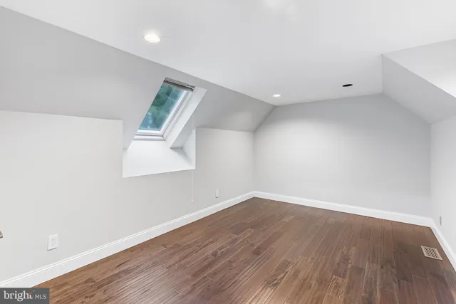 a workspace with furniture and wooden floor
