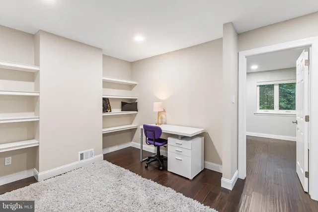 a view of kitchen and empty room