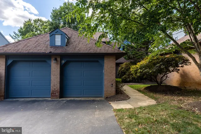 a view of a door of the house with a door and wooden floor