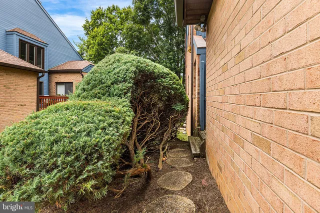 a view of a brick house with a large window