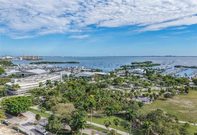 a view of a multi story building in front of a house