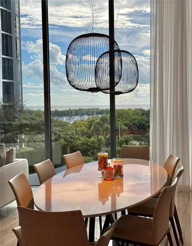 a view of a dining room with furniture window and outside view