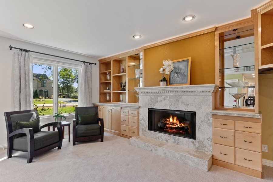 120 Chestnut Road Northbrook, IL 60062 - Photo 4 of 22 a living room with furniture and a fireplace