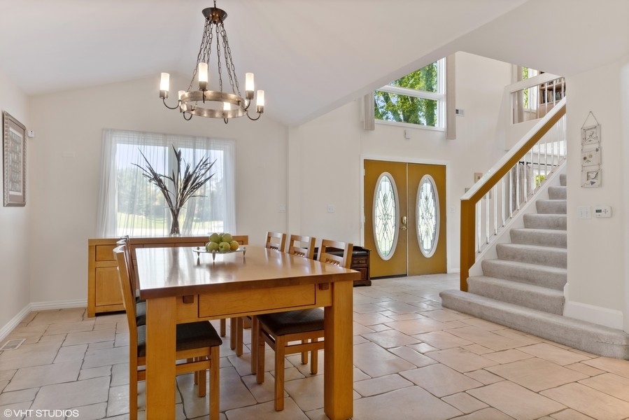 120 Chestnut Road Northbrook, IL 60062 - Photo 6 of 22 a view of a dining room with furniture and a chandelier