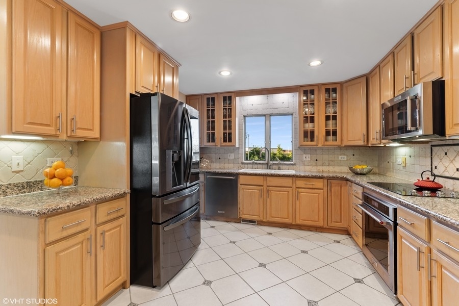 120 Chestnut Road Northbrook, IL 60062 - Photo 8 of 22 a kitchen with stainless steel appliances granite countertop a refrigerator stove and sink